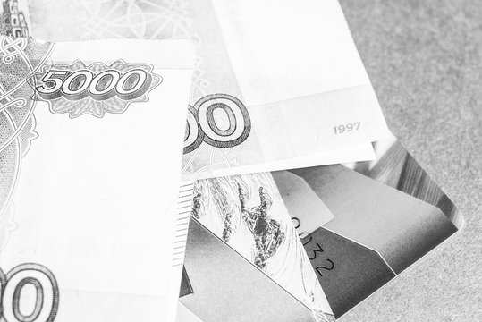 Credit cards and money, black and white frame.