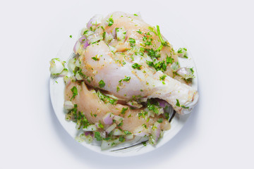  slices of raw chicken meat in a dish prepare for cooking. isolated on white background