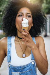 Portrait of a beautiful woman eating one ice cream.
