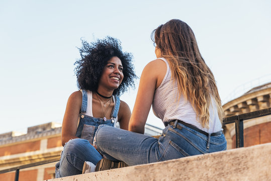 Beautiful Women Chatting In The Street.