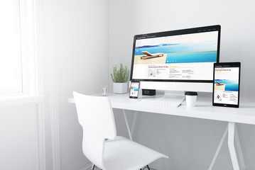 Fototapeta na wymiar devices on white minimal workspace resort and spa website