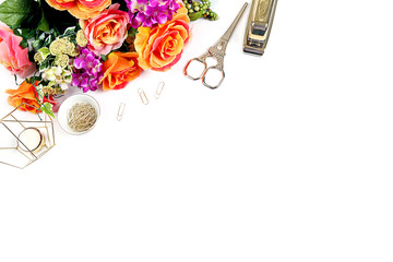 Styled desktop with whte bckground, flowers, gold stapler, gold accessories