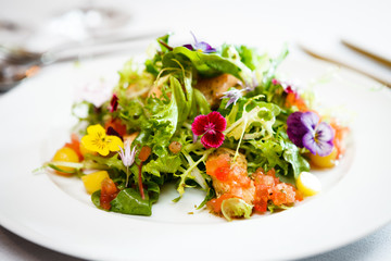 Green salad on a white plate