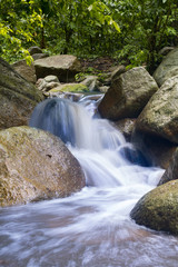 Obraz premium waterfall after rain. waterfall in the forest.