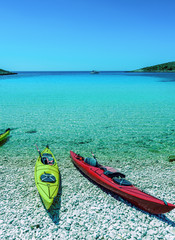 Naklejka premium Canoe Boats on a bay of Kornati islands, National park in Croatia, Adriatic sea:SIBENIK,CROATIA,May 28,2017