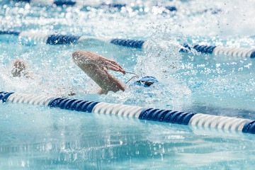 Young Female Swimming Freestyle