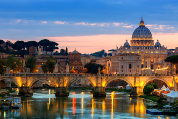 Night view of old Sant' Angelo Bridge  and St. Peter's cathedral in Vatican City Rome Italy. - obrazy, fototapety, plakaty