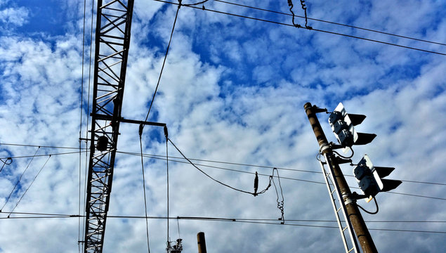 High voltage electric industrial gear on a background of blue cloudy sky
