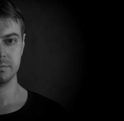Black and white portrait of a young man.