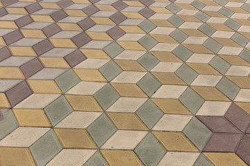 View of a monotonous colored brick stone on the ground for a street road.