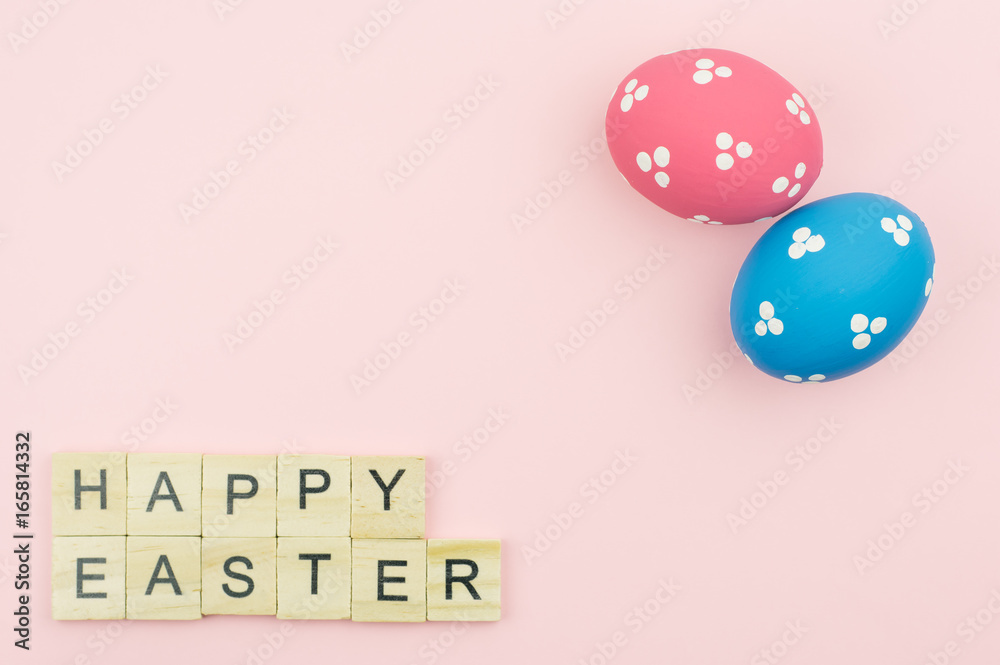 Sticker Text wooden blocks spelling the word happy easter on pink background