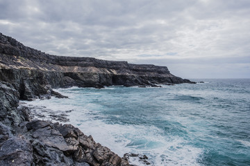 Fototapeta na wymiar Stormy coast, Cuevas de los Molinos, Fuerteventura