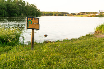 wood sign in grass