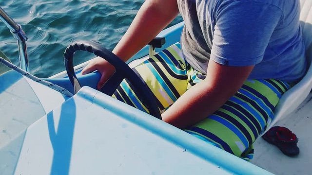 Boy on the sea boat