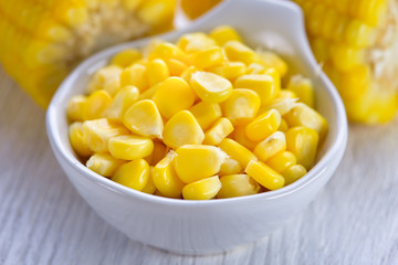 corn in a bowl on wood