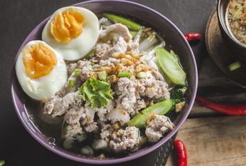  Spicy Tom Yam Wide Rice noodles soup with Vegetables and meats.