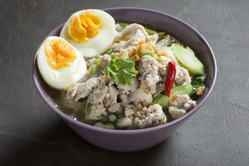 Spicy Tom Yam Wide Rice noodles soup with Vegetables and meats.