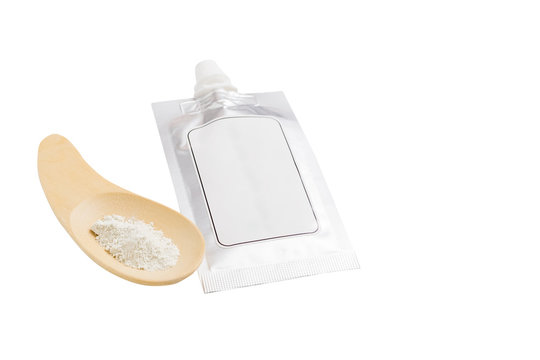 Blank spout pouch with cap and wood spoon on white background