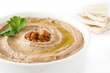 Lentil hummus and pita bread isolated on white background

