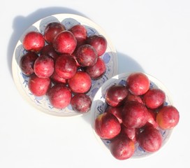 Plums on two plates