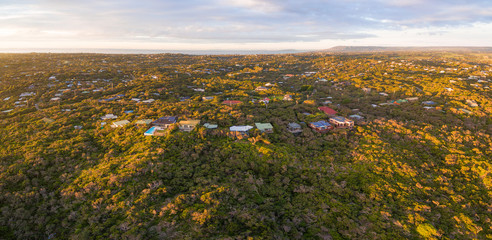 Fototapeta premium Aerial panoramic view of luxury homes in Rye suburb at sunset. Melbourne, Australia