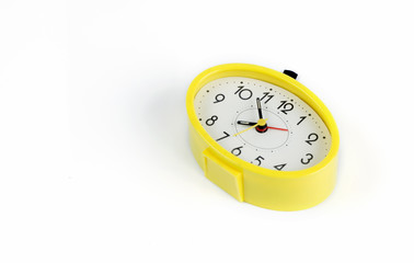 yellow alarm clock isolated on white background