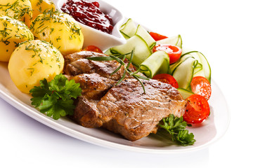 Fried steak, boiled potatoes and vegetable salad