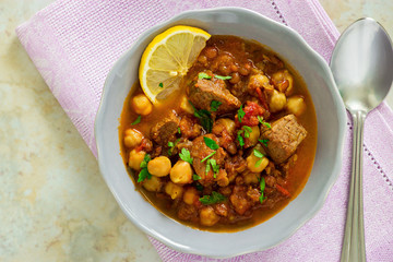 Moroccan soup harira with meat, chickpeas, lentil, tomato and spices. Hearty, fragrant. Preparing for Iftar in the holy month of Ramadan