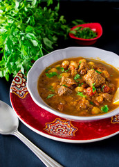 Moroccan soup harira with meat, chickpeas, lentil, tomato and spices. Hearty, fragrant. Preparing for Iftar in the holy month of Ramadan