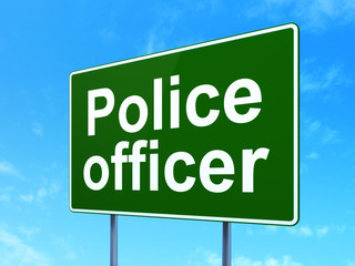 Law concept: Police Officer on road sign background
