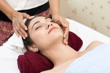 Fototapeta na wymiar Close up of Beautiful young woman having head massage in spa salon wellness, Beauty healthy lifestyle and relaxation concept.