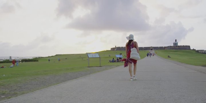 Slow motion of Female tourist walking outdoors in beautiful place
