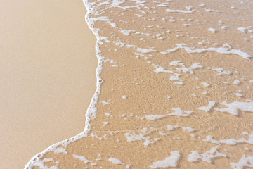 Wave of the sea on the sand beach