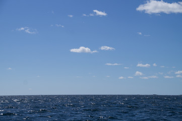 Obraz premium blue cloudy sky over the sea