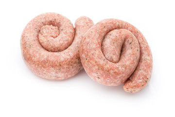 Raw sausages with herbs and spices.