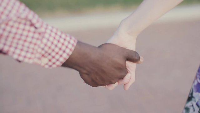 two joining hands, International friendship theme
