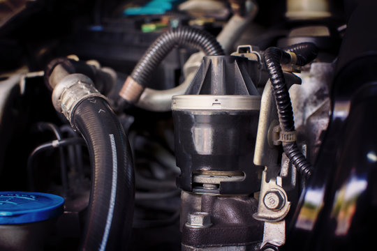 Close Up Of The Old Exhaust Gas Recirculation In The Engine Compartment To Reduce The Carbon Monoxide Gas From The Exhaust. Automotive Part Concept.