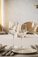 Empty glasses and plates set on the table in restaurant