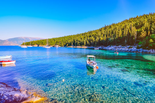 Calm and idyllic Beach of Foki Fiskardo with crystal clear and transparent water, Kefalonia, Ionian islands, Greece