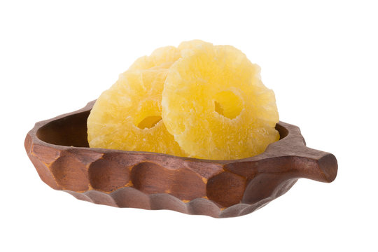 dried ananas slices In the basket, candied pineapple slice isolated on white background