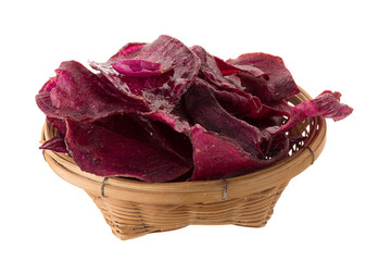 purple potatoes Sliced and fried crisps In the basket isolated on white background