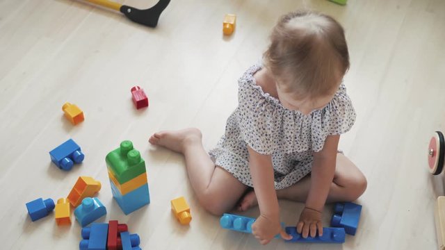 child little girl playing wooden toys at home or kindergarten, baby kid intellectual games children's desinger