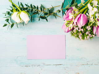 Empty purple card flowers tulips roses spring pastel color background. Easter holiday, wedding birthday invitation