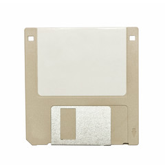 top view of a beige vintage floppy disk on white background