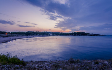 Dark sunset in Rosas bay, Costa Brava, Spain.
