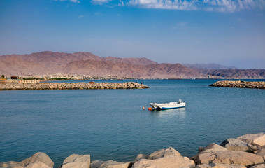 Landscape of Eilat coastline, Israel over Aqaba city and Jordan mountains.