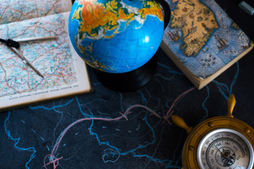 Globe on a black matte background with lights.