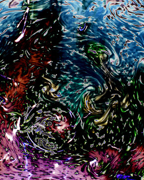 macro closeup of the flow-like currents of color and textures in a handmade glass bowl