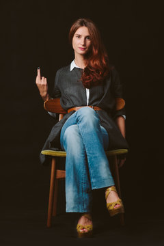 Redhair woman showing her middle finger