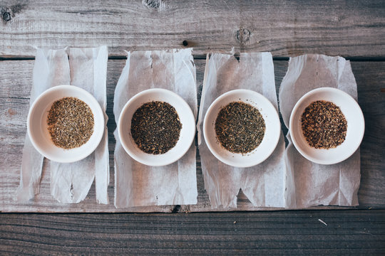 Selection of herbal tea leaves removed from paper teabags.